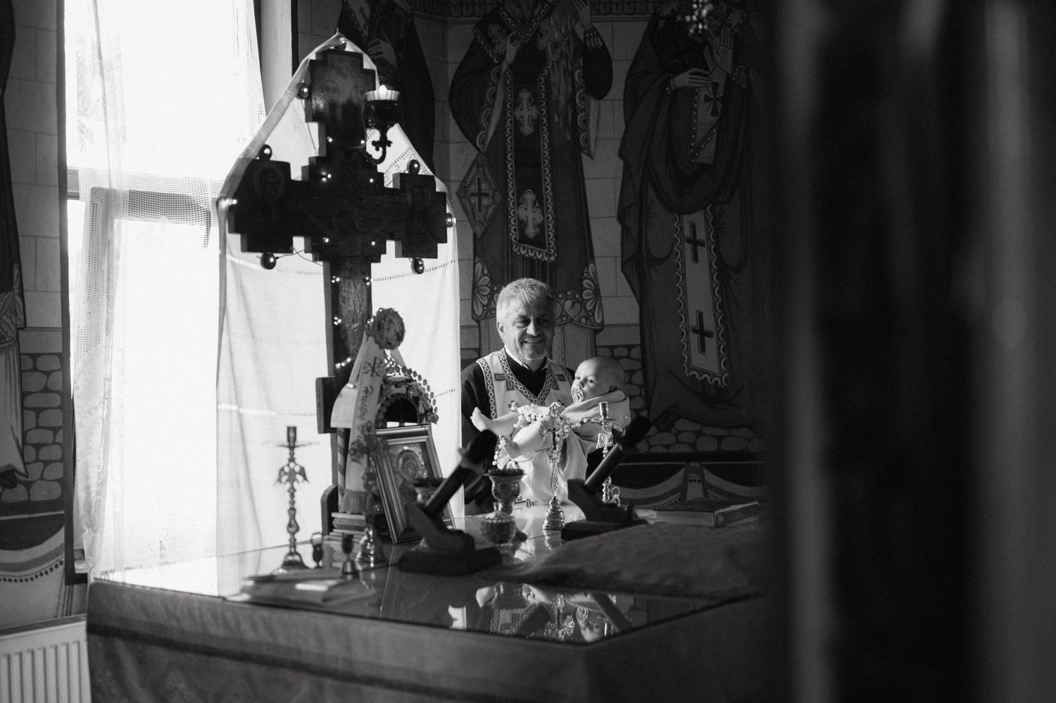 Montage of black and white photos shows contrasting interior spaces with decorative architectural elements and lighting.