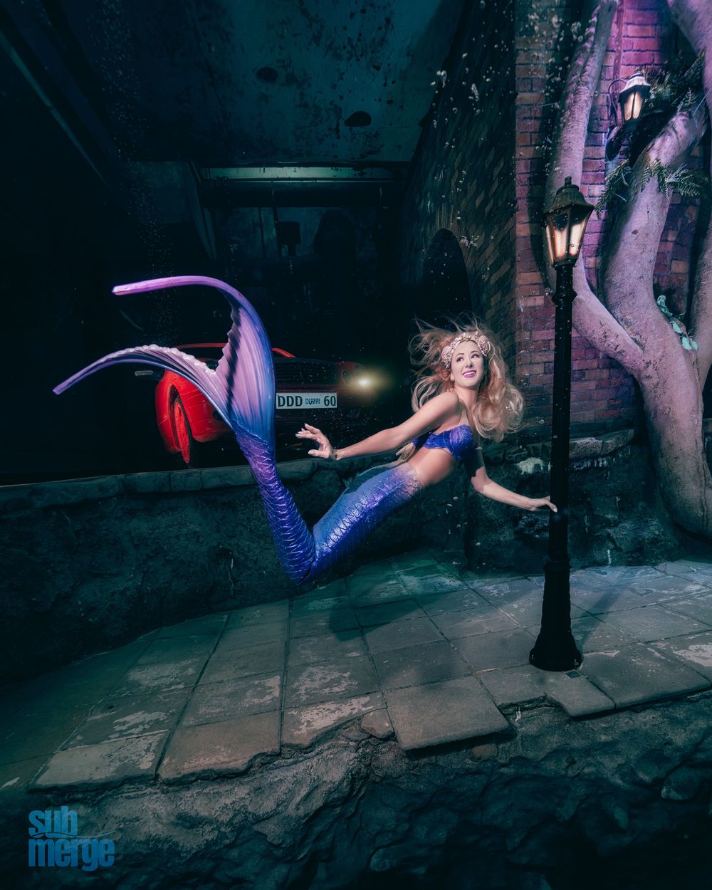 A sequence of dynamic dance poses captured against a dark urban nighttime backdrop with purple lighting effects.