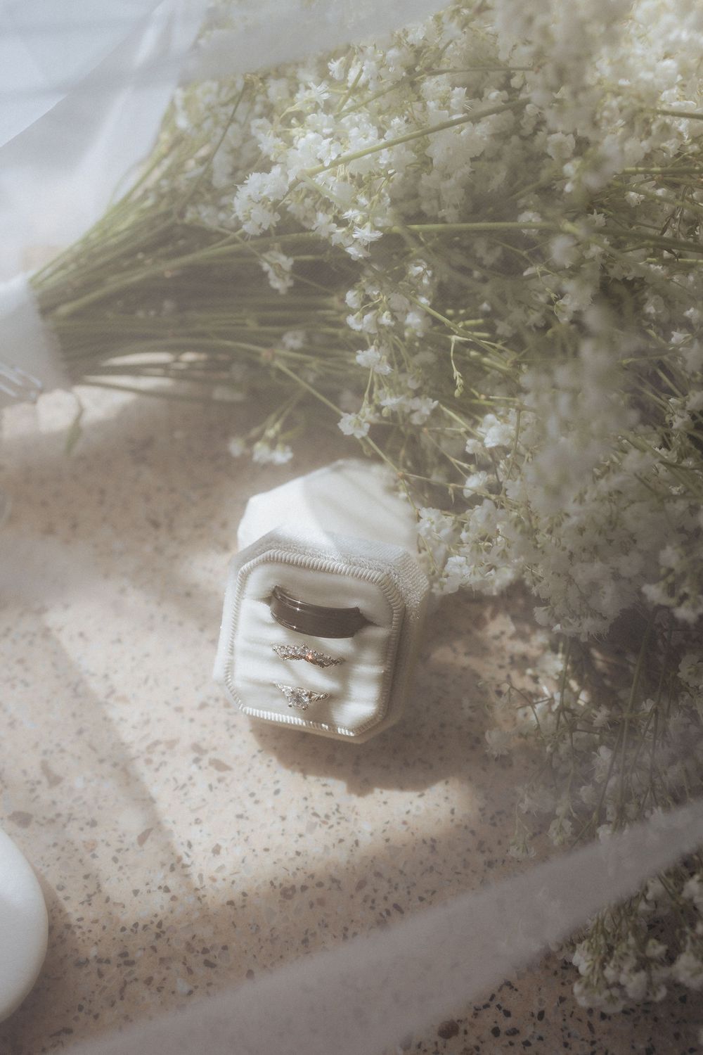 Beautiful wedding details in New Brunswick, Canada. Veil bouquet and wedding ring set film vibes flat lay detail photography