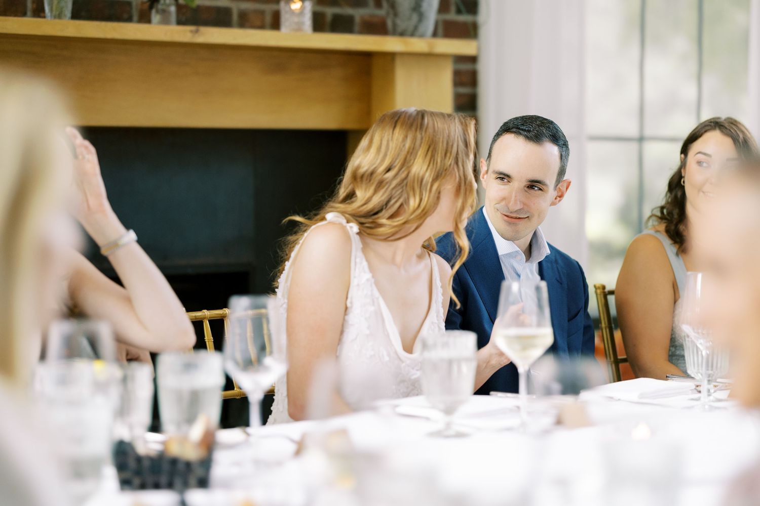 Bride and groom chat at the dinner table at Ninety Acres and Pendry Natirar