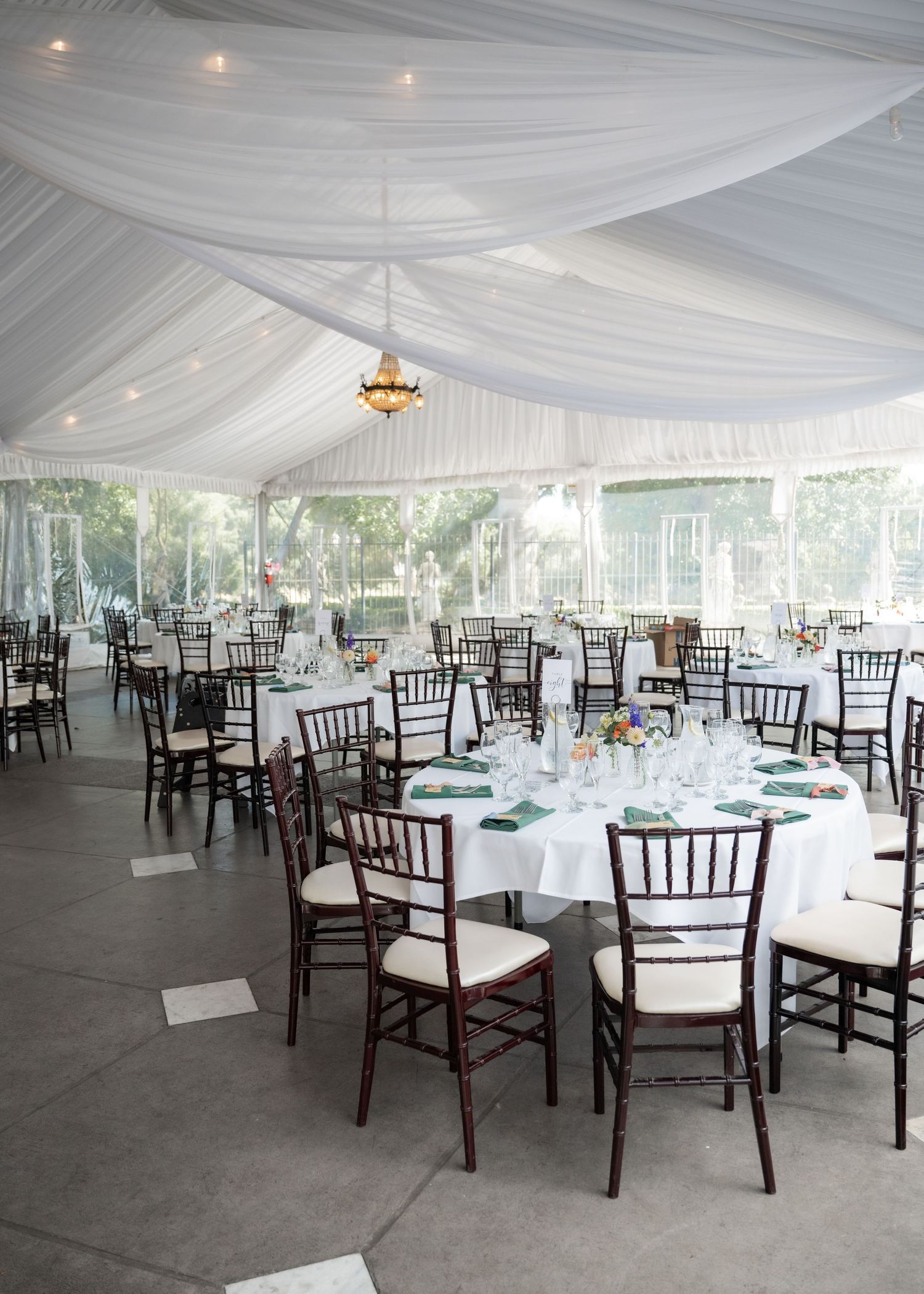 Wedding reception setup inside Jefferson Street Mansion tented pavilion
