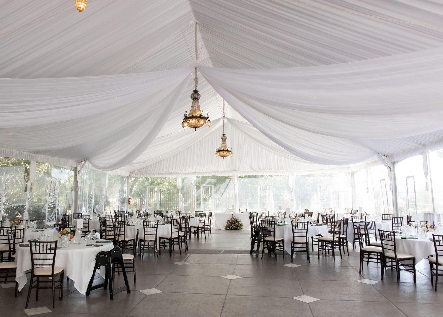 Bright and elegant reception space at Jefferson Street Mansion with tables and linens