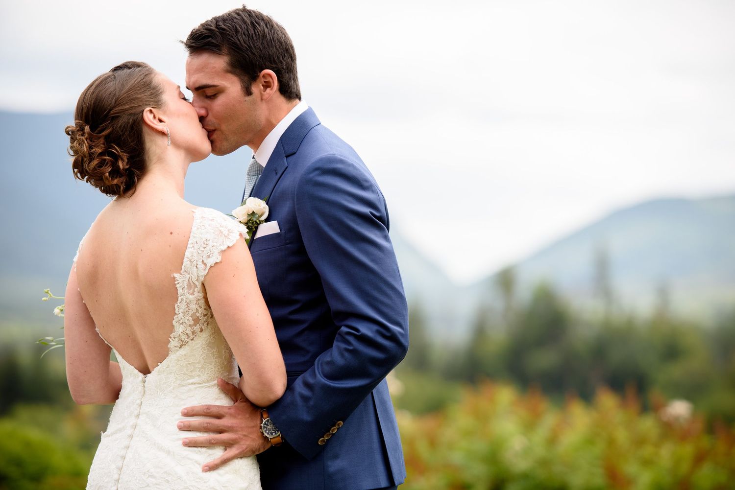 Artistic wedding portraits with couple in romantic outdoor mountain setting.