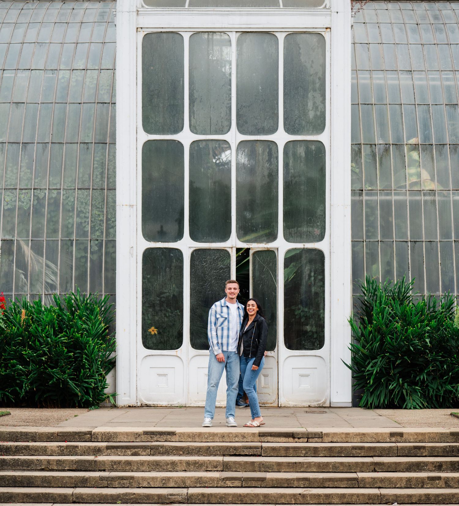 Four consecutive frames show a greenhouse entrance with concrete steps and ornate white architectural details.