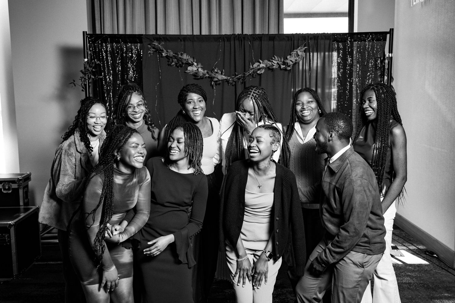 Black and white candid shots of people enjoying themselves at an indoor event.