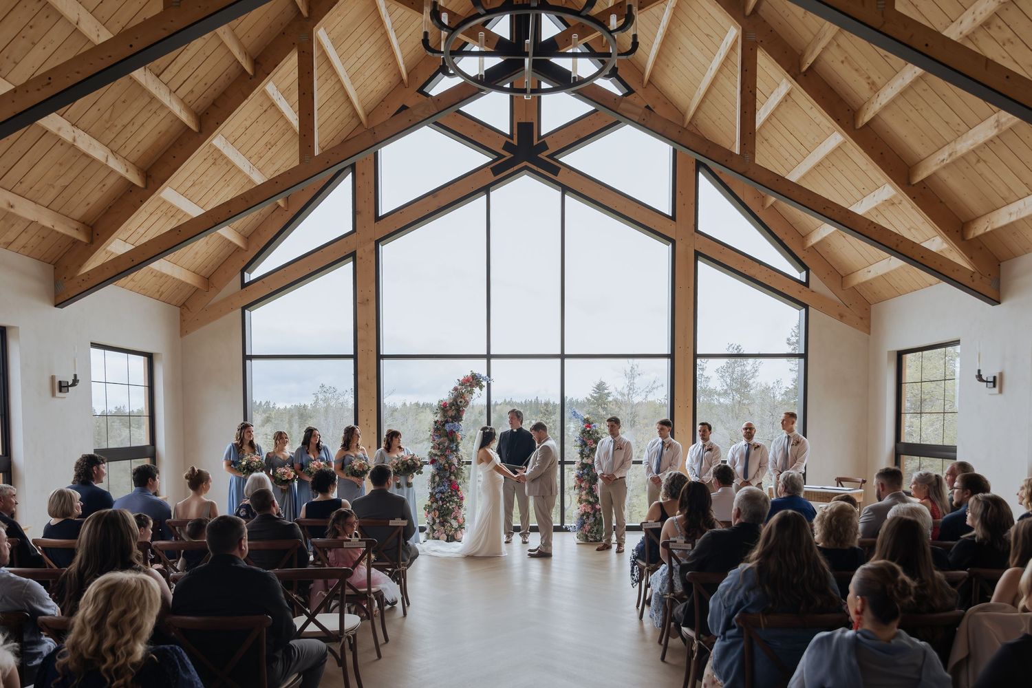 bride and groom holding hands during romantic wedding ceremony Cidery at 51 Acres wedding photography Moncton photographer packages