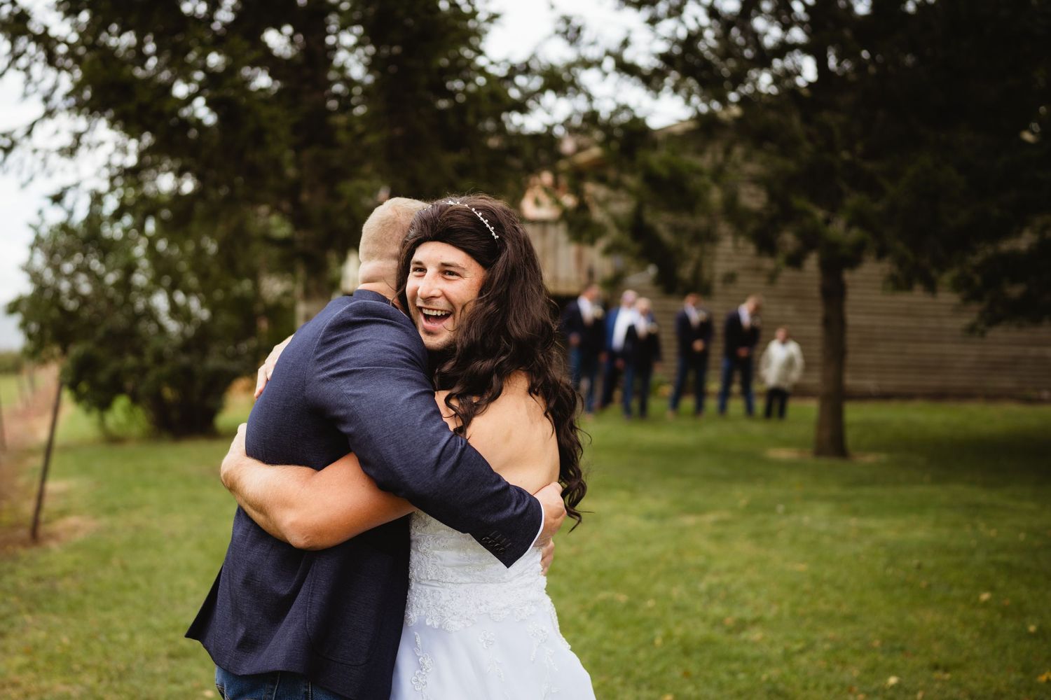 A sweet candid moment between newlyweds during an outdoor wedding photoshoot.