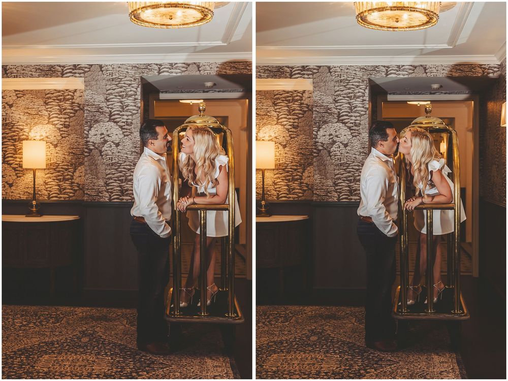 A couple shares a romantic dance together in a rustic venue with exposed brick walls and warm lighting.