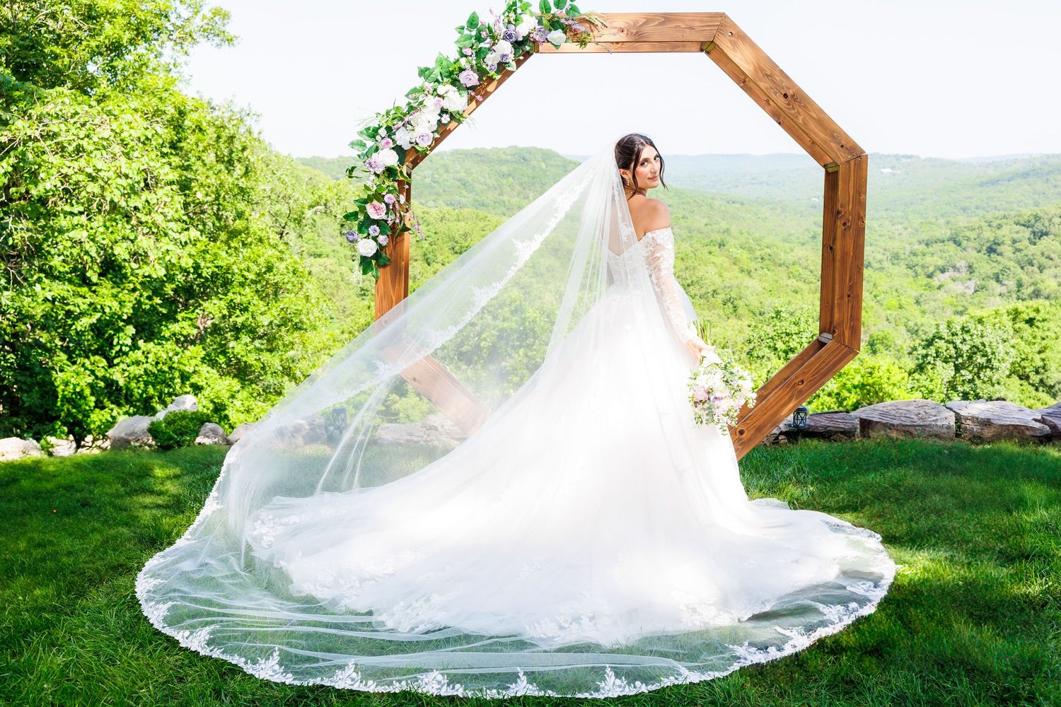 Bride with long veil at Graystone Valley in Branson Missouri by Janie Loftin Photography.