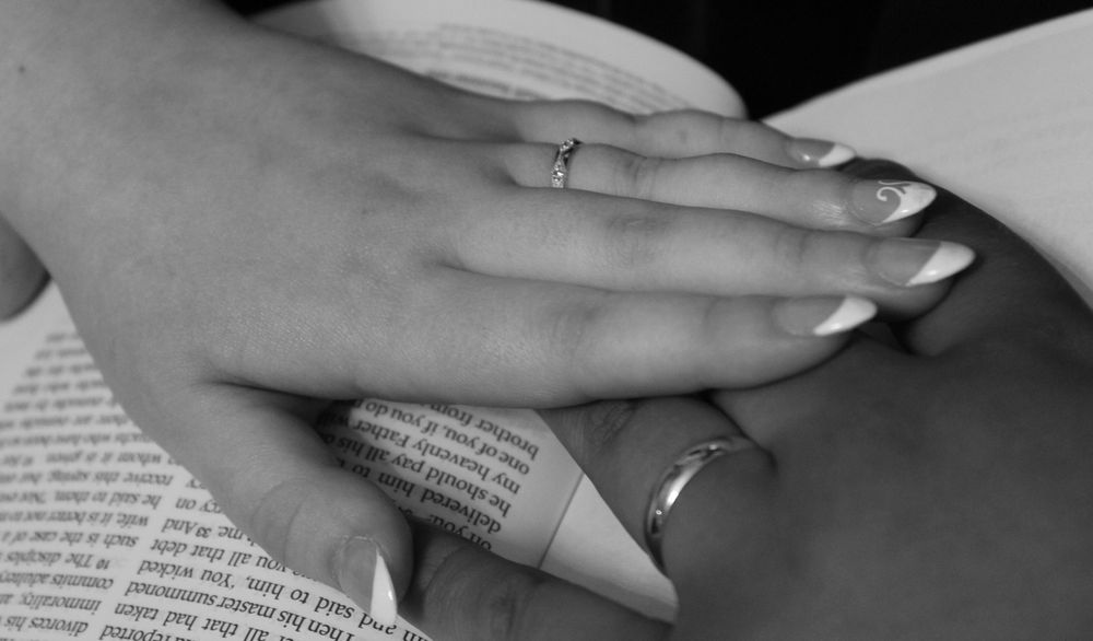 Cassie & Jeremy's hands with rings.