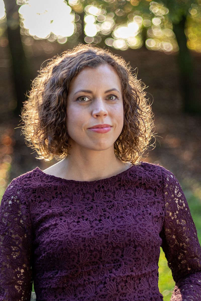 Corporate woman in sunny outdoor portrait