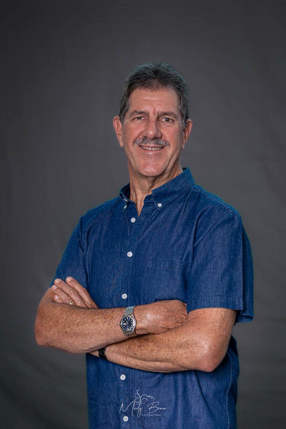Corporate man standing studio portrait