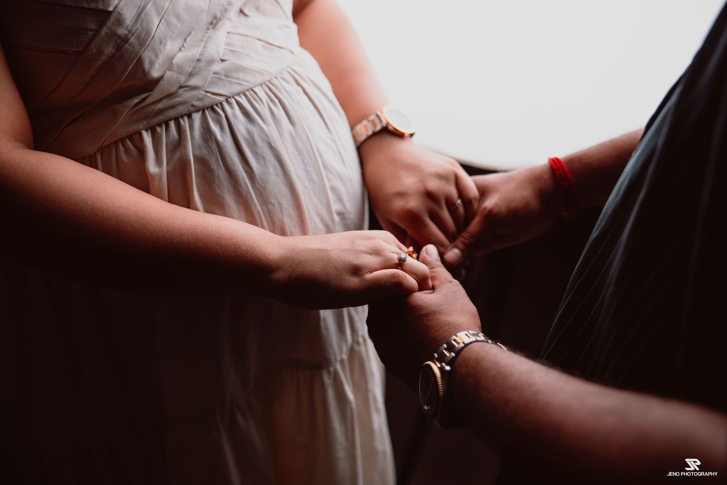 couple holding hands, raw moments captured by Jeno Photography