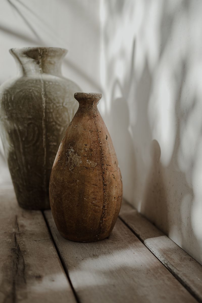 Clay vases with soft light in jungle suite decor during La Valise Tulum elopement Riviera Maya wedding photographer.