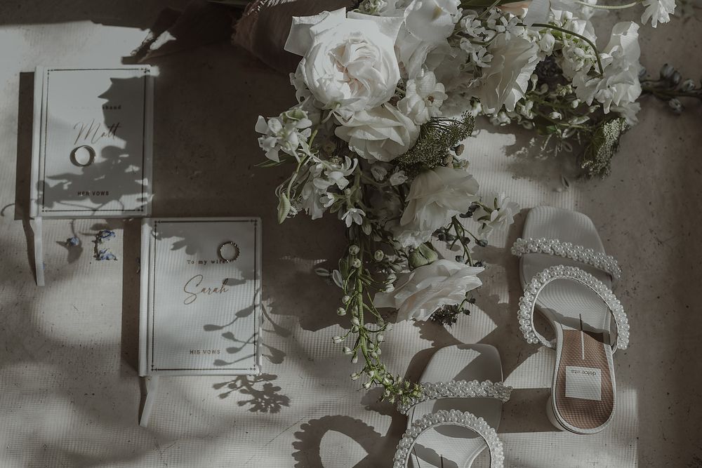 Flat lay with bridal shoes bouquet and details during intimate La Valise Tulum elopement Riviera Maya wedding photographer.