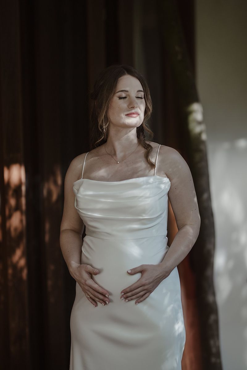 Bride smiling in silk gown with natural light during La Valise Tulum elopement Riviera Maya wedding photographer.