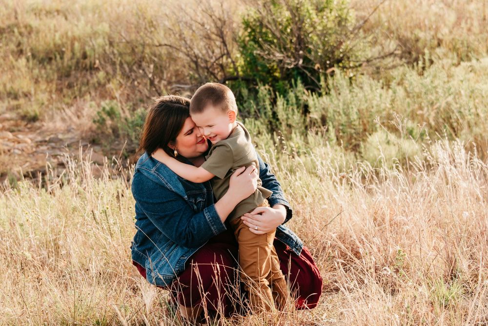 Candid moments captured of a couple in casual attire enjoying time together in a natural setting.
