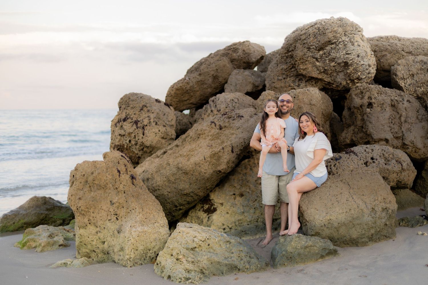 gorgeous family photoshoot picture with massive rocks at deerfield beach florida