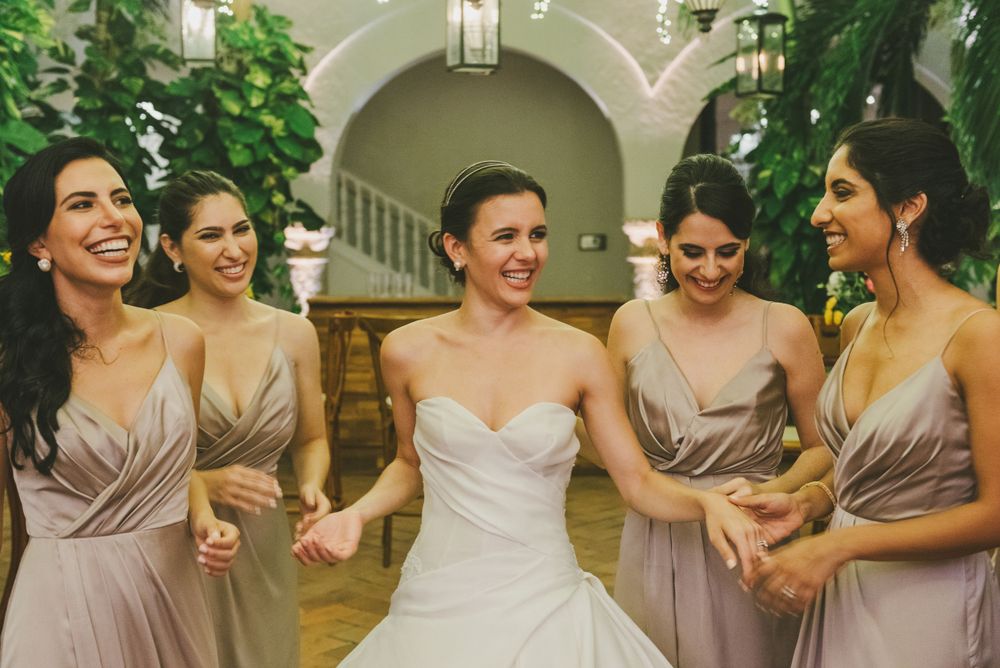 Bride surrounded by her bridesmaids in Cartagena.