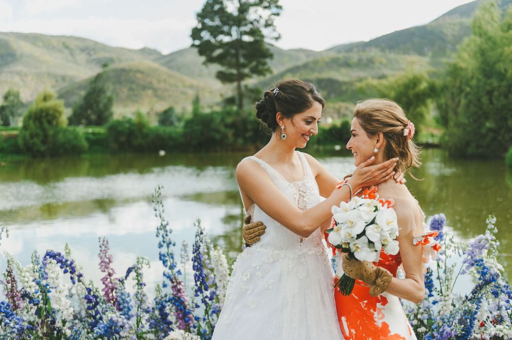 Bride and her mother embracing.