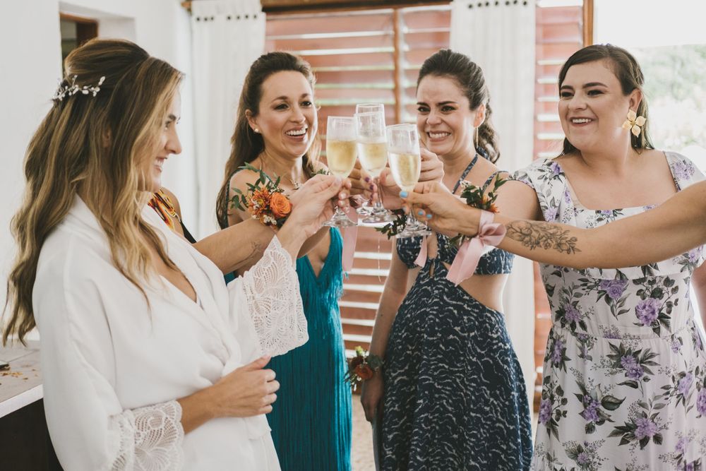 Bride and her bridesmaids toasting moments before the wedding ceremony.