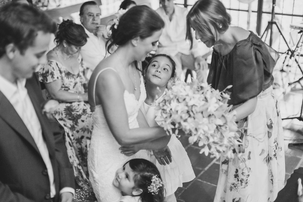 Ring bearer looks up at the bride during wedding ceremony.