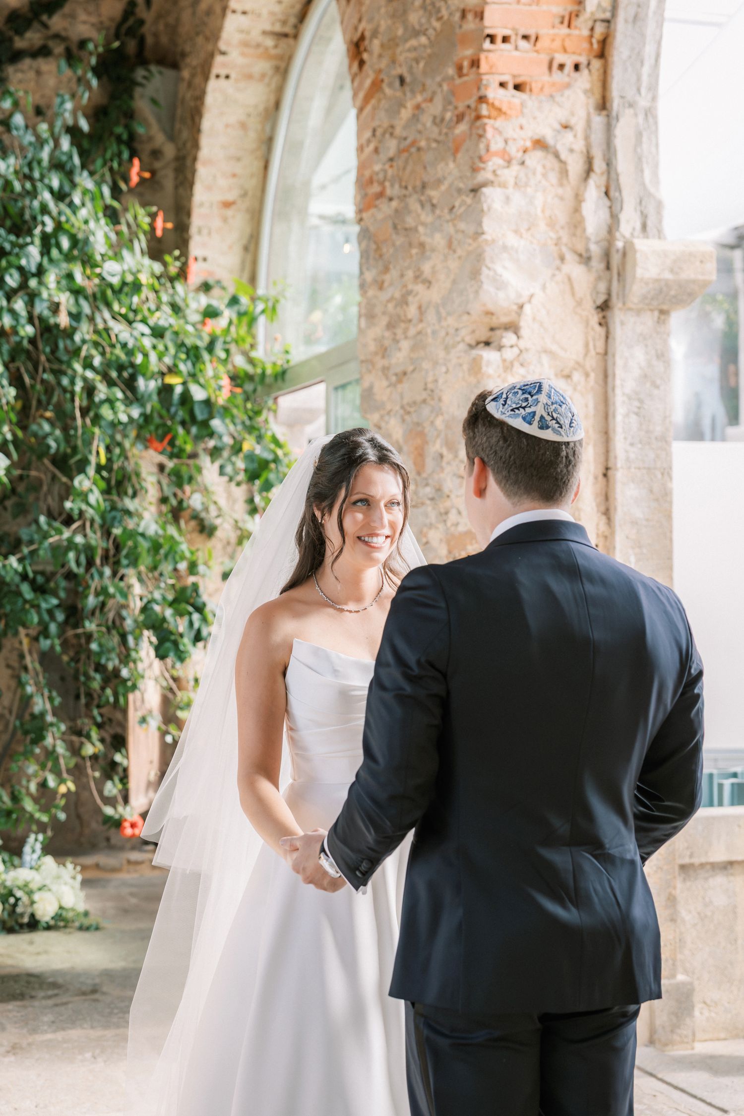 Bride and groom sharing intimate first look moment in Cascais Portugal wedding