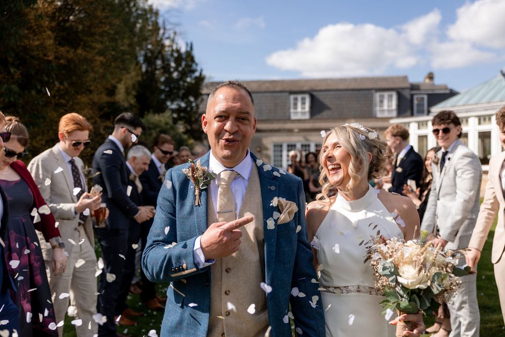 Confetti moment at a spring wedding in Wiltshire