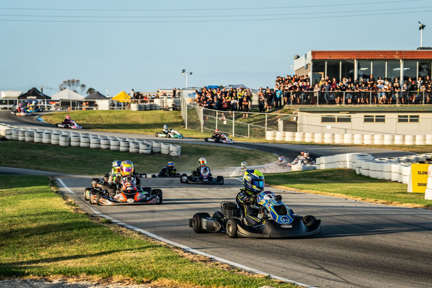 Aiden Schweikert leads the pack down the back straight at Oakleigh