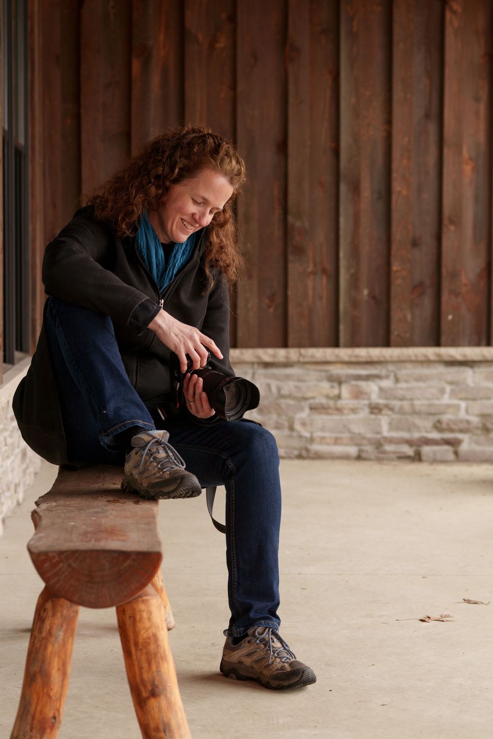 Outdoor photographer having a quiet moment reviewing images.