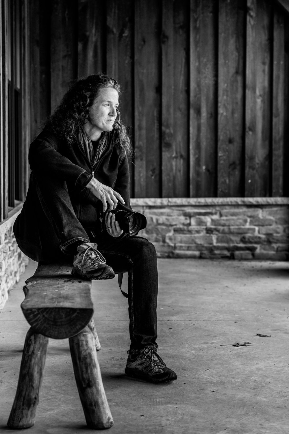 Classic black and white photographer portrait outside.