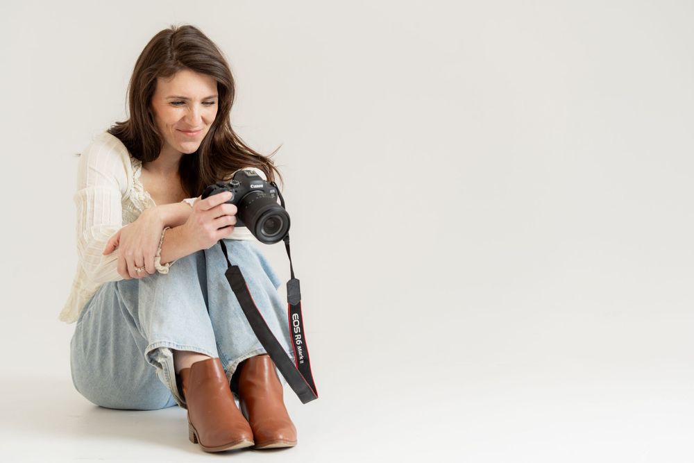 Photographer reviewing images in her studio portrait session
