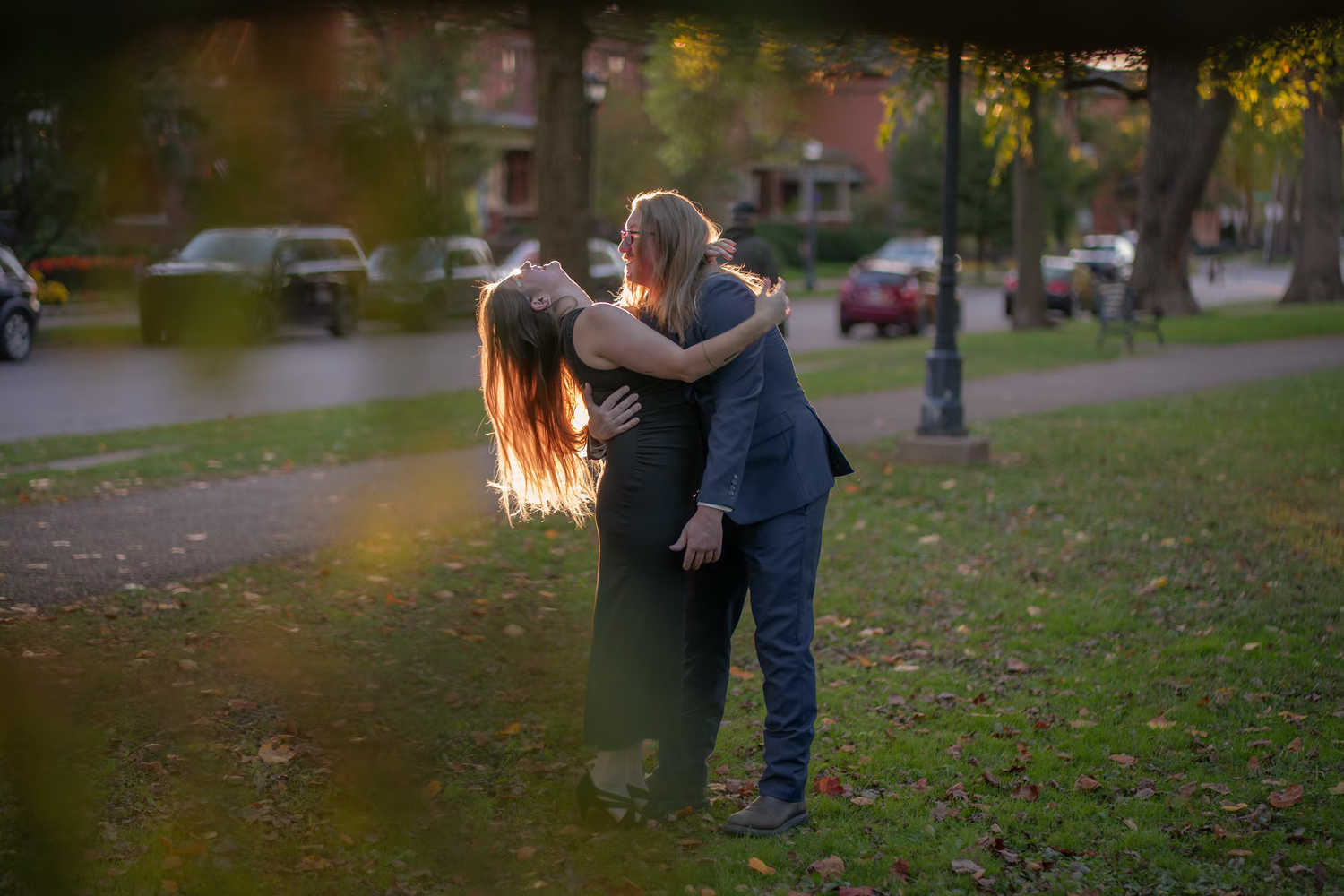 Couple embracing romantically in a sunlit park, in German Village Engagement Photos