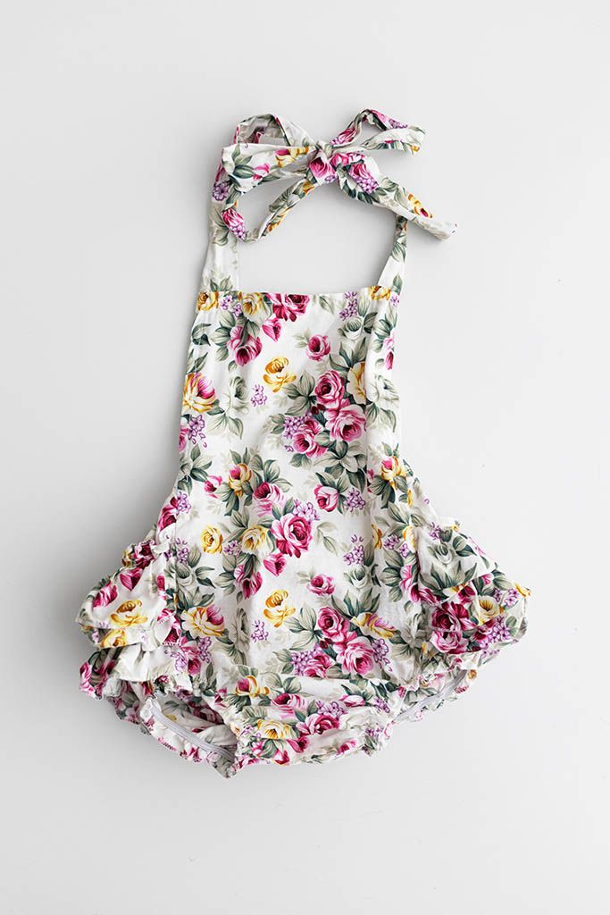 White floral print halter bubble romper from Menifee baby photographer's client closet.