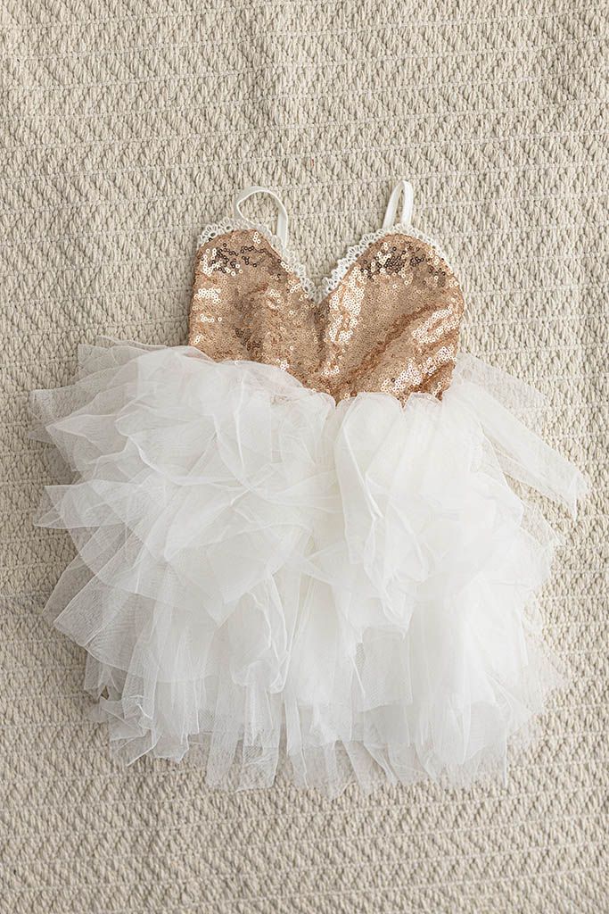 2nd birthday photoshoot outfit in Fallbrook CA: White ruffled tulle girls dress with rose gold sequins.