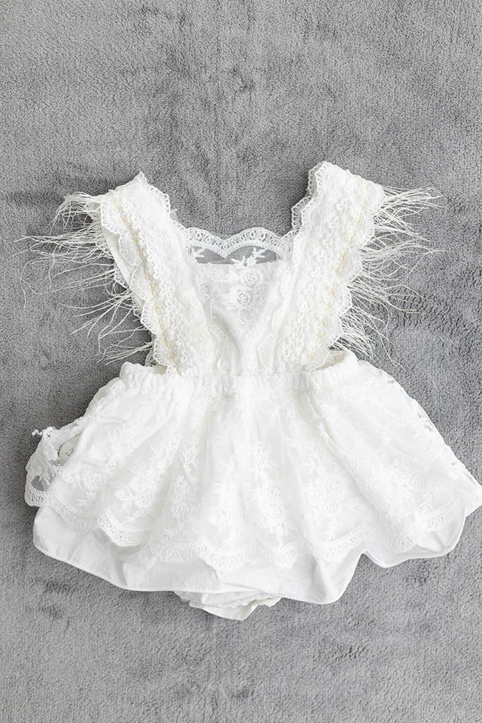 White lace baby romper with feather trim from Murrieta first birthday cake smash selection of outfits.