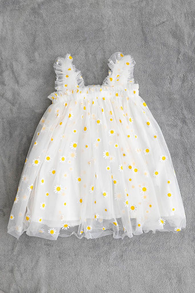 Cute outfit for baby's first birthday photography: White tulle baby dress with yellow daisies.