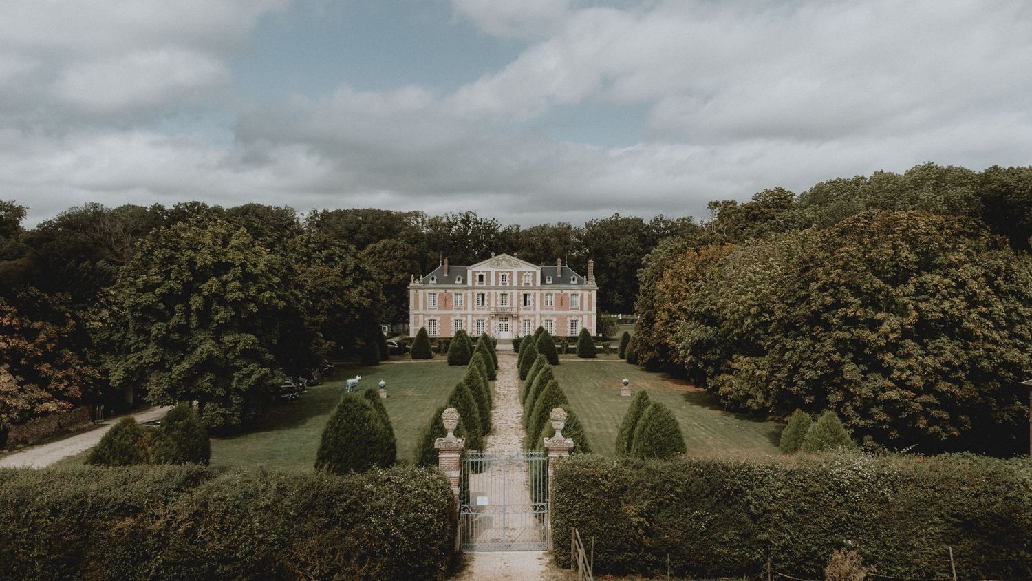 Grand classical architecture of Chateau Garembourg, a premier wedding venue in France for luxury destination weddings