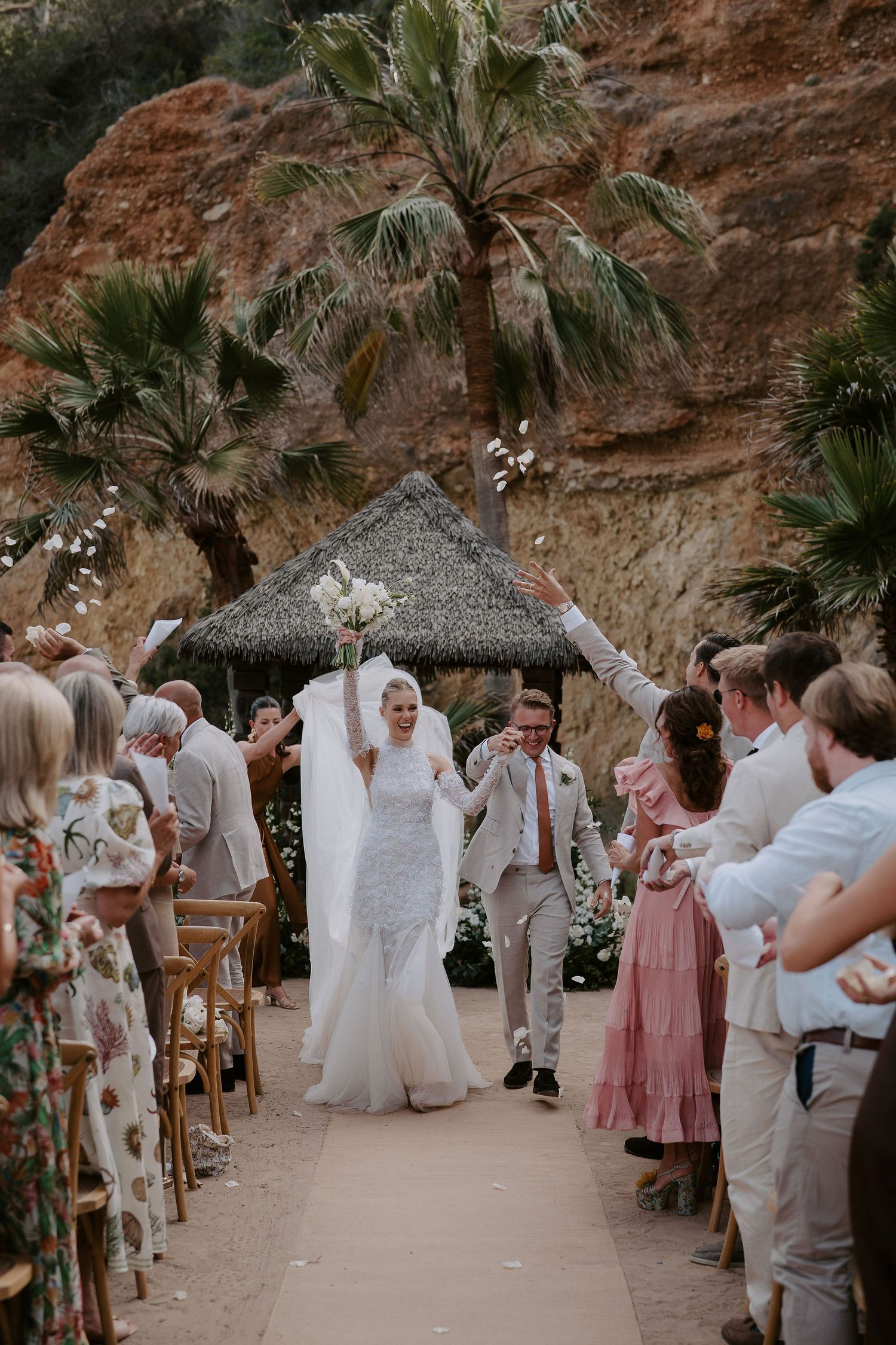 bride and groom exiting ceremony with confetti toss at Amante Ibiza