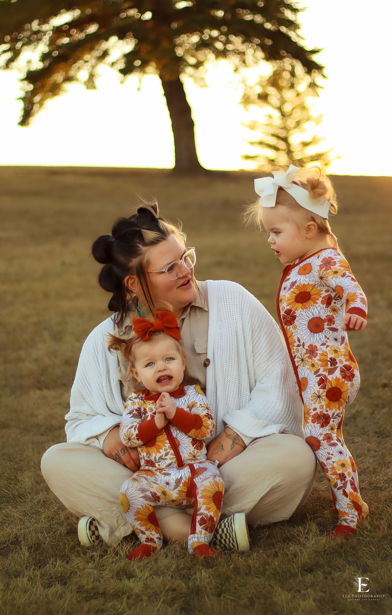 A tender family moment captured in autumn sunlight with matching floral outfits in Williston, North Dakota.
