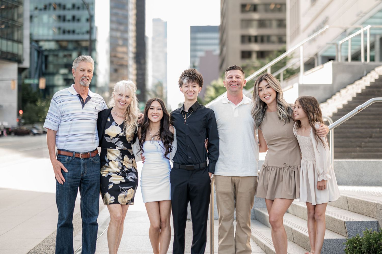 A series of outdoor family portraits showing multiple groups posing together in casual attire.