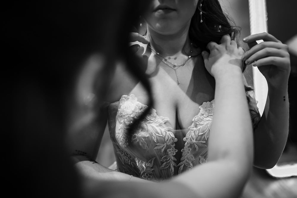 A black and white photo montage showing seven different wedding moments with couples and wedding details.