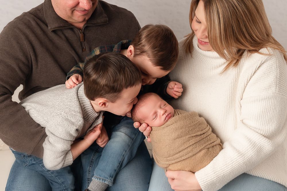A family with newborn image created in a Pittsburgh photography studio