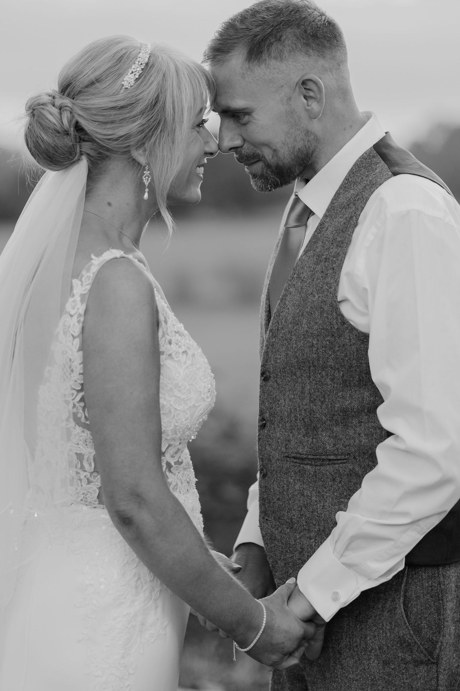 A romantic black and white wedding photoshoot sequence showing tender moments between newlyweds.