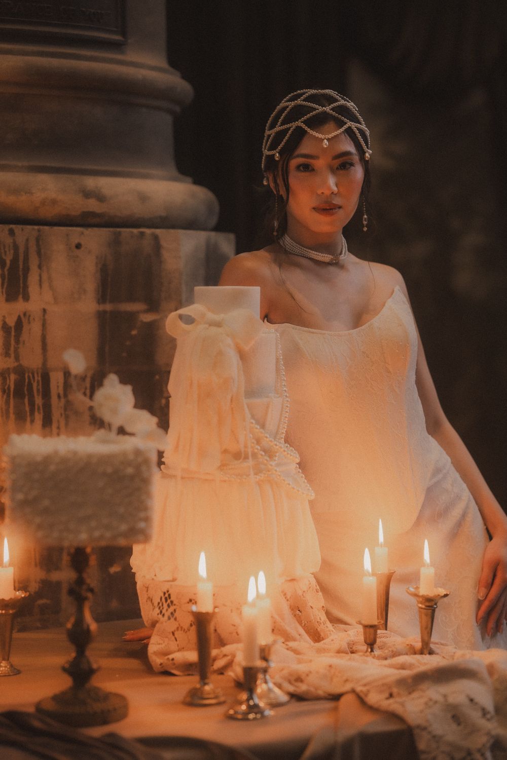 A vintage-inspired scene with glowing candles and white lace details creating a romantic, ethereal atmosphere.