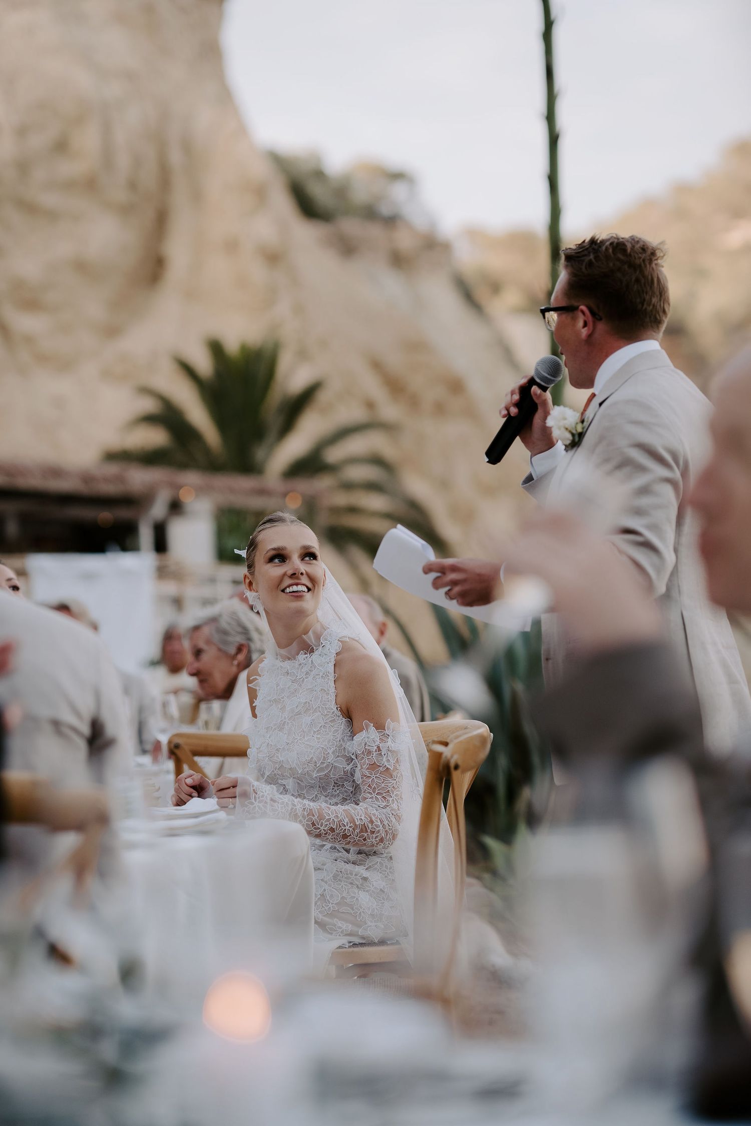 bride smiling at groom during grooms speech at amante ibiza