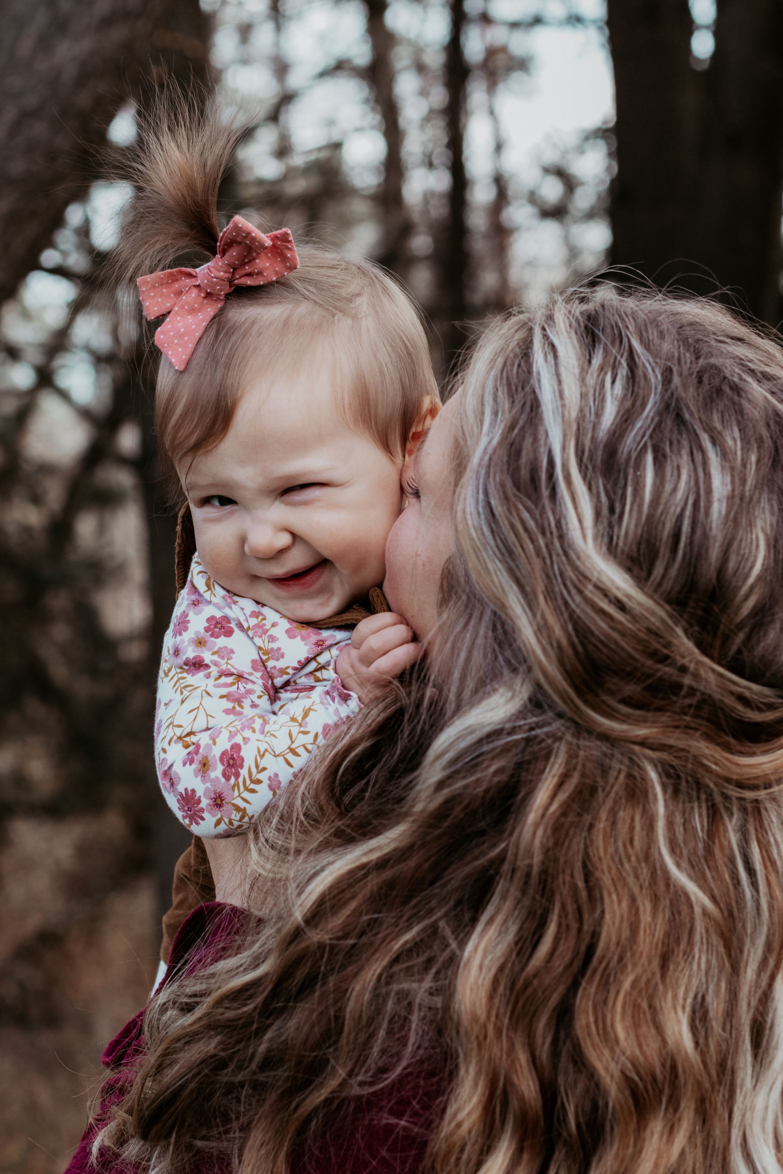 A close-up series of joyful expressions and laughter in a wooded setting.