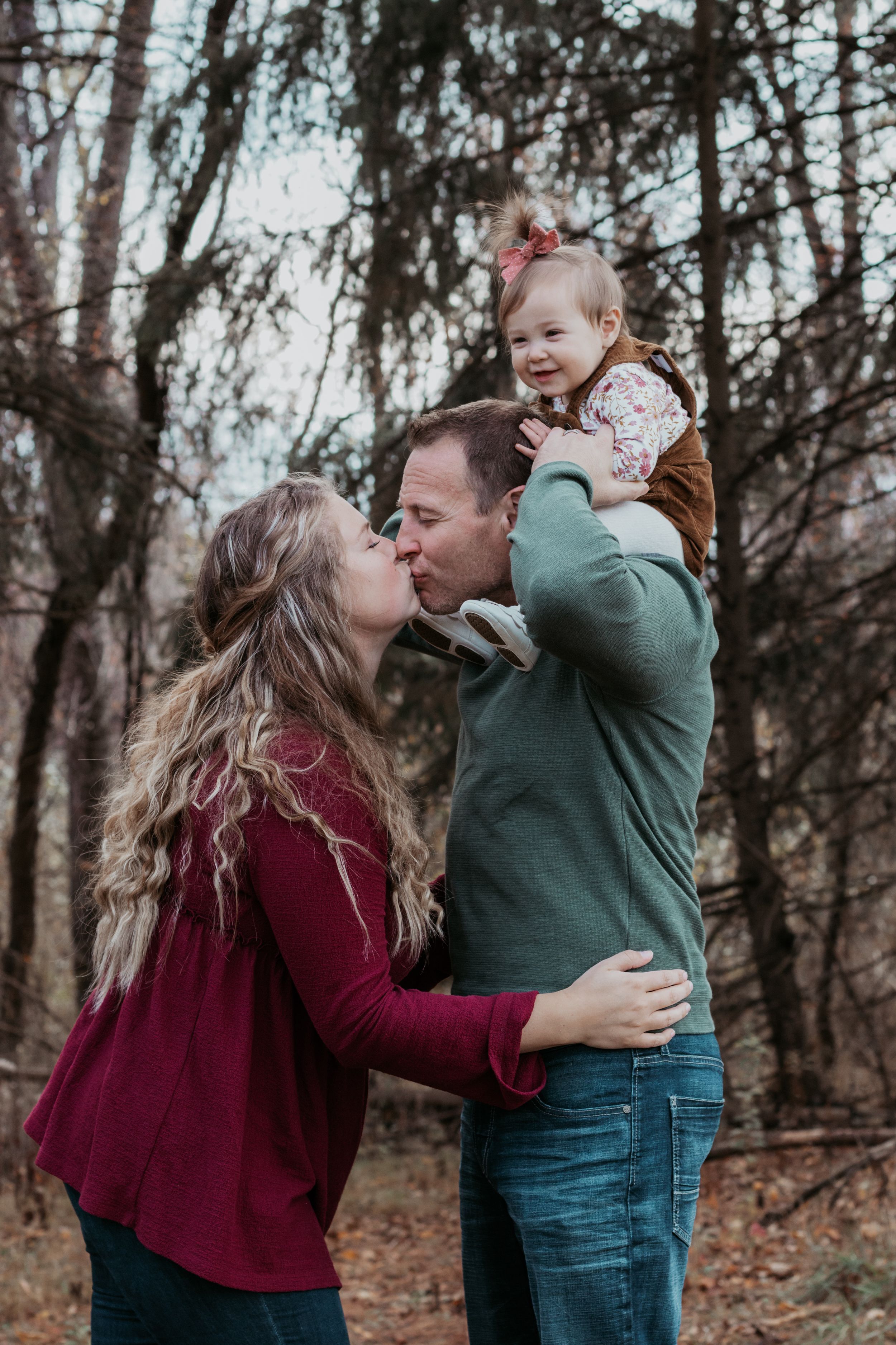 Candid sequence of family interaction and laughter in a wooded area.
