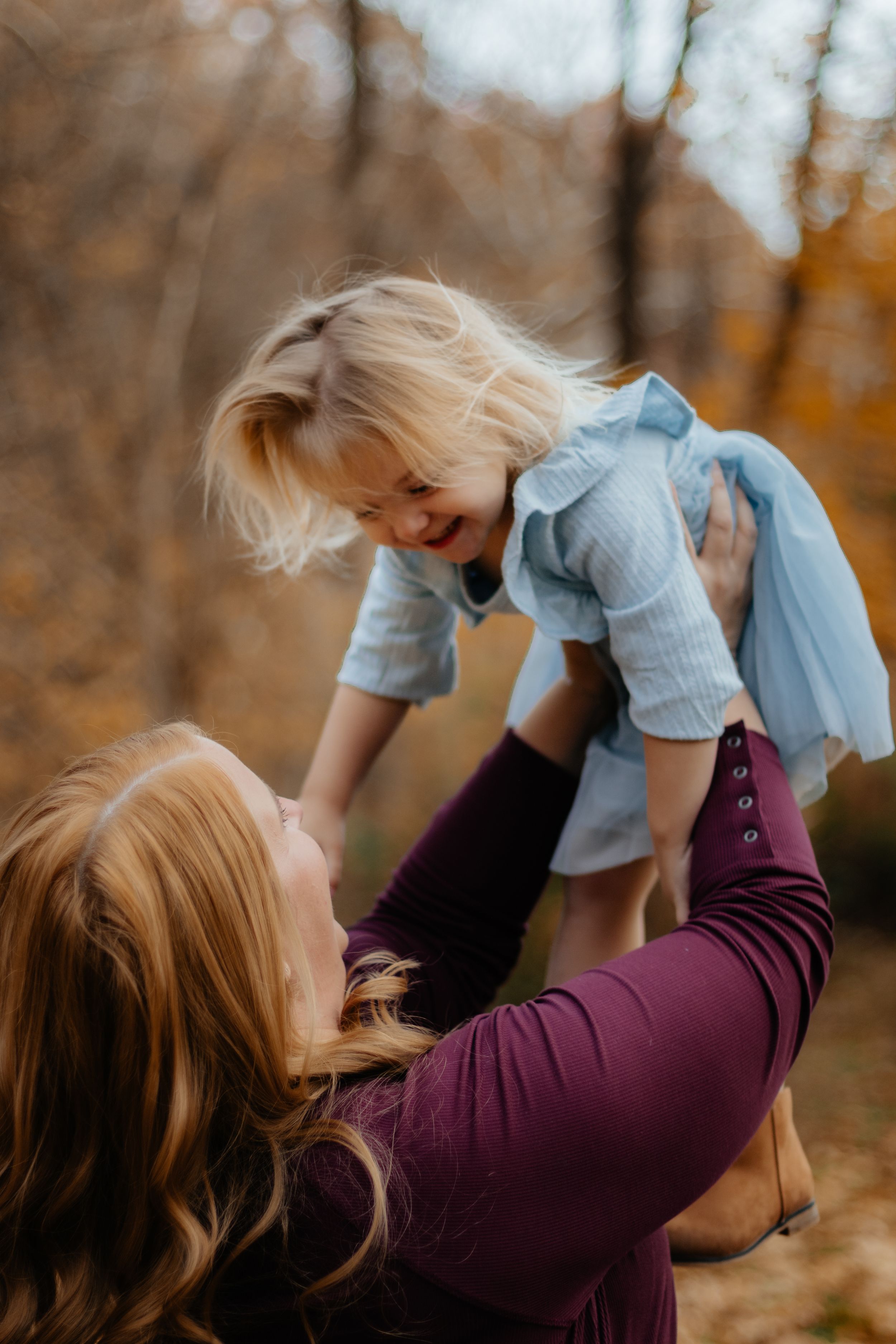 Sweet interactive moments captured during a fall family photo session.
