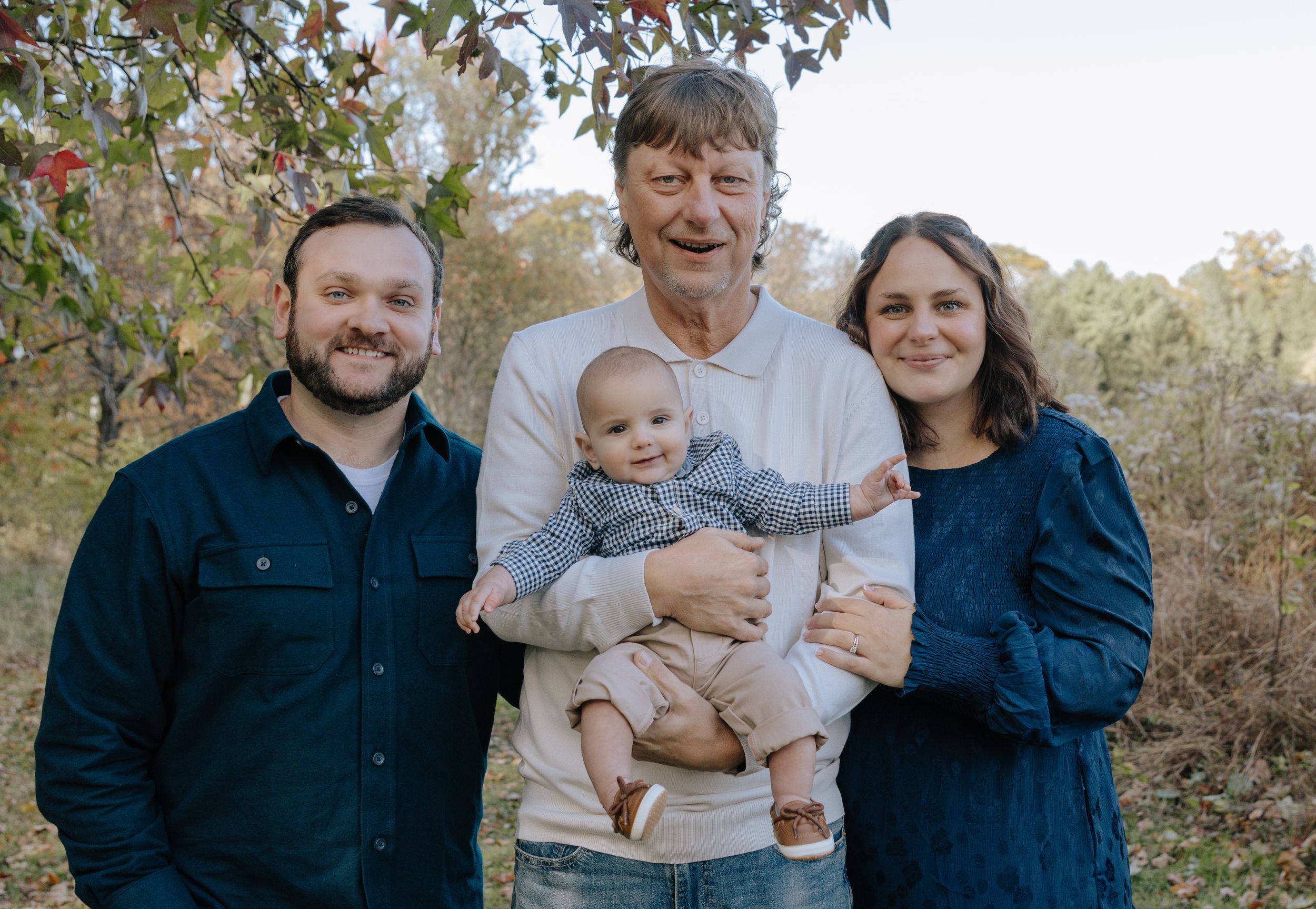 Casual family portrait session capturing candid moments in nature.